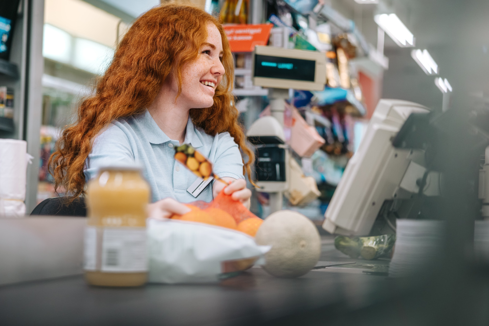 female grocery store worker at checkout