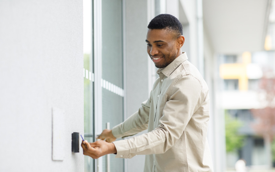 man scanning access card at front door