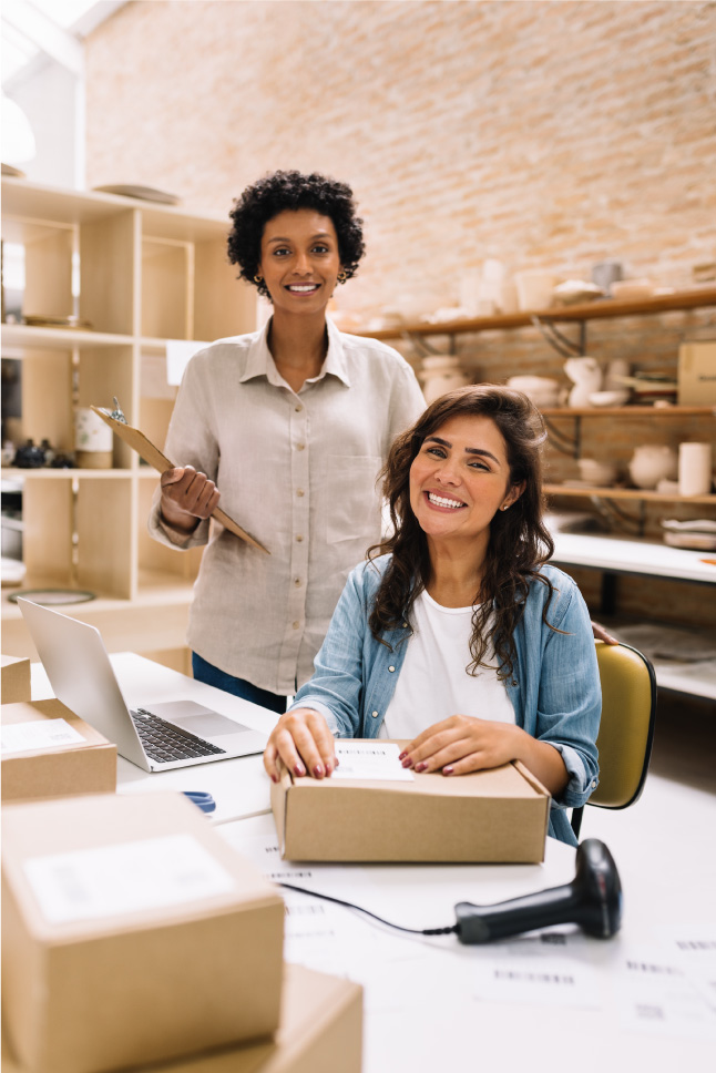 female retail workers happy at counter