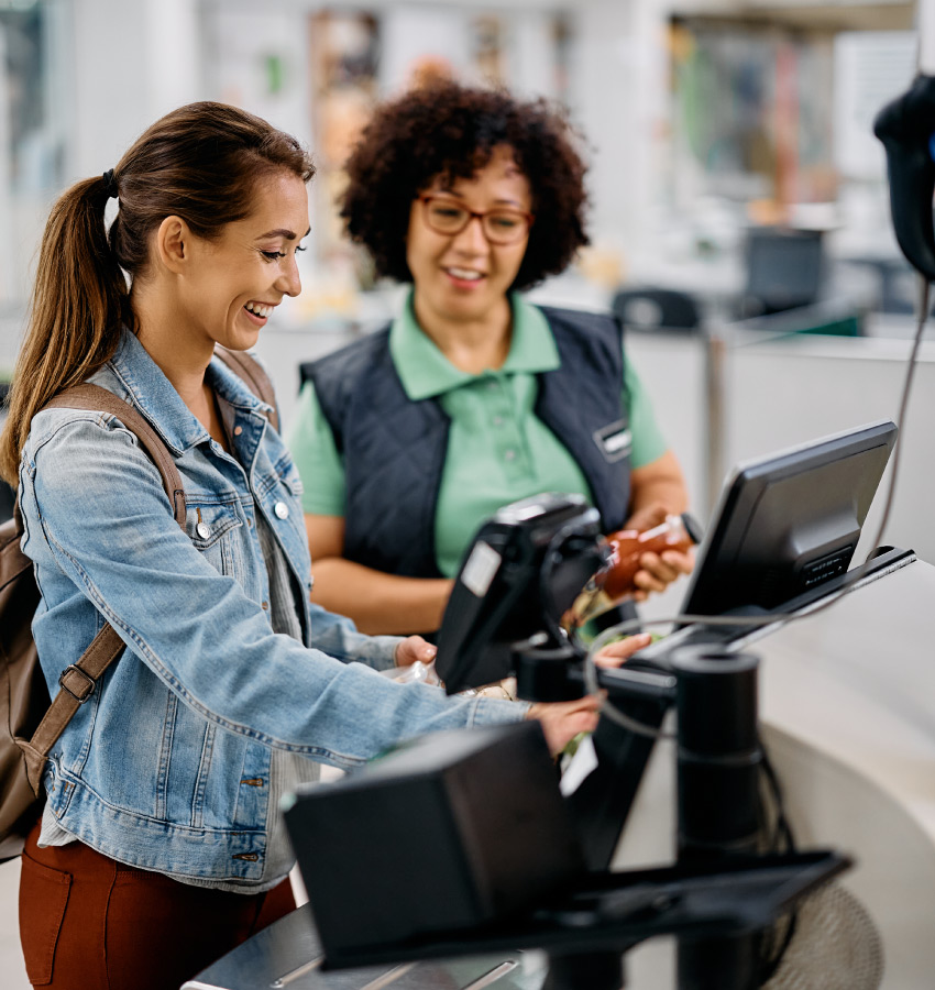 woman checking out at grocery store