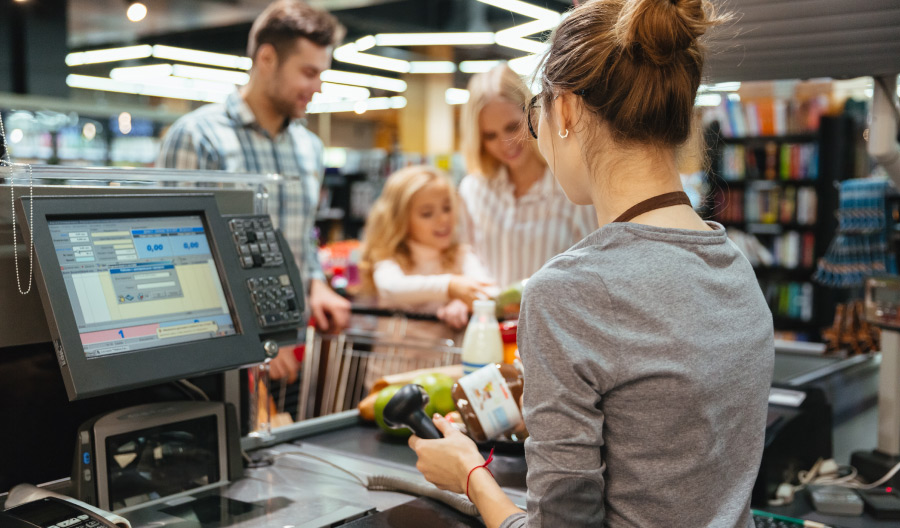 family at grocery checkout